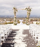 White Flower Petal Aisle "Runner"
Photography: Aevitas Weddings
Read More:
http://www.insideweddings.com/weddings/rooftop-ceremony-ballroom-reception-with-english-garden-theme/1286/ wedding ceremony on rooftop los angeles city view rustic chuppah arch white flower petal aisle chair