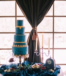 Blue-and-Gold Cake, Display
Photography: Meghan Rose Photography
Read More:
http://www.insideweddings.com/weddings/fairy-tale-winter-styled-shoot-inspired-by-beauty-and-the-beast/926/ beauty beast movie styled wedding shoot blue gold cake lumiere candelabra clock rose glass case