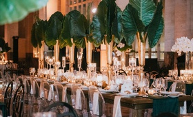 Elephant Ear Centerpieces on Long Table
Photography: Jonathan Connolly Photography
Read More:
http://www.insideweddings.com/weddings/elegant-modern-wedding-with-emerald-color-palette-in-miami/1307/ wedding reception emerald green color palette long table ghost chair with elephant ears, orchids