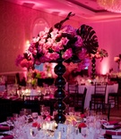 Modern Vibrant Reception
Photography: Couture Foto
Read More:
http://www.insideweddings.com/weddings/stacey-janks-and-eric-jasper/385/ White sequin table with black orb vase and pink flowers