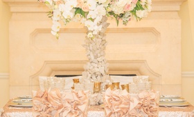 Ruffled Chair Sleeves
Photography: Thisbe Grace Photography
Read More:
http://www.insideweddings.com/weddings/inspirational-wedding-shoot-inspired-by-geology-glam-textures/678/ Wedding reception with pink and white flowers on quartz stand, pink chair sleeves with ruffles