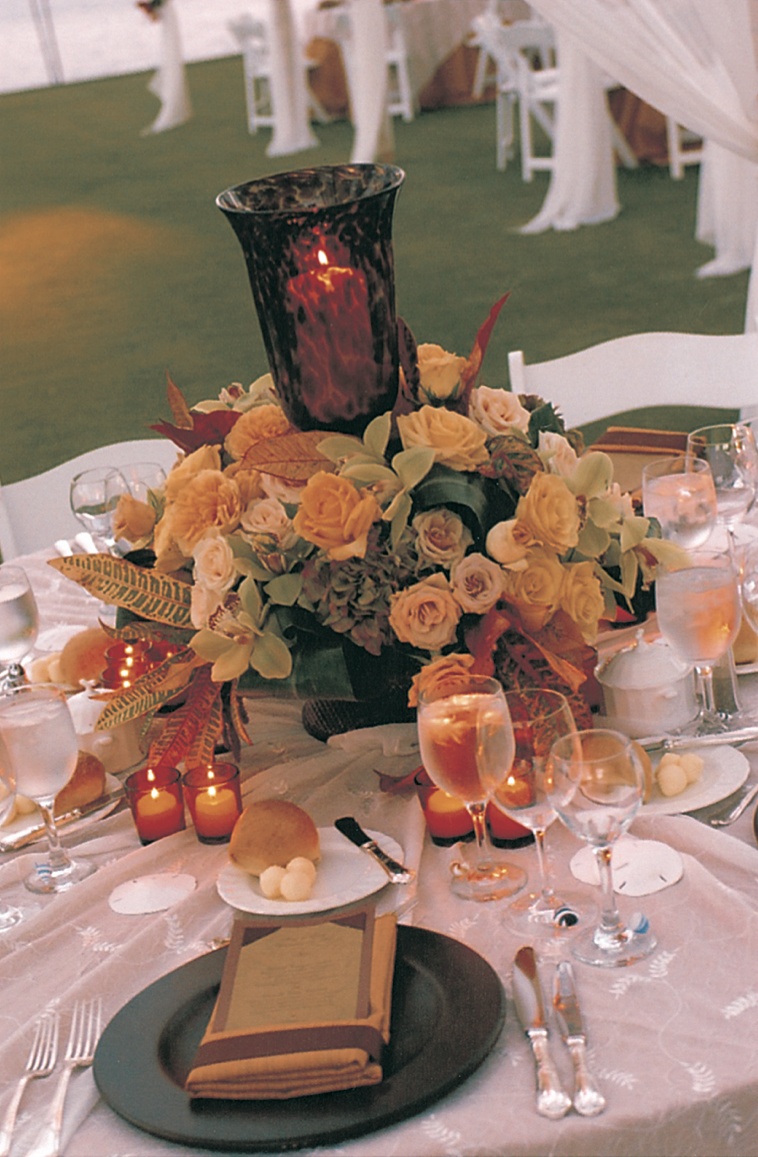 Yellow and Green Flower and Candle Decor
Photography: David Michael Photography
Read More:
http://www.insideweddings.com/weddings/tropical-seaside-wedding-in-lanai-hawaii/60/ tabletop decor of yellow and green flowers and orange candles