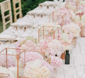 Copper Candle Holders %26 Pink Flowers
Photography: Maitha Lunde
Read More:
http://www.insideweddings.com/weddings/beautiful-alfresco-destination-wedding-in-the-south-of-france/1039/ Wedding reception long centerpiece mini rose arrangements candle votives rose gold vessels geometric