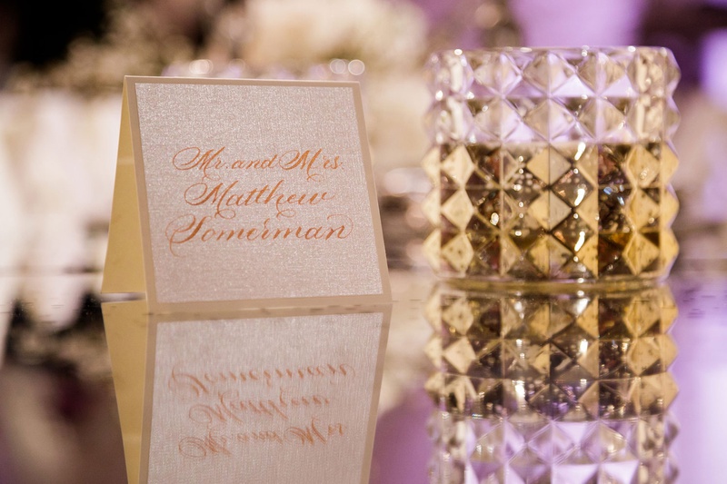 Rose Gold Calligraphy Escort Card
Photography: Bob %26 Dawn Davis Photography
Read More:
http://www.insideweddings.com/weddings/modern-glamorous-jewish-wedding-with-unique-decor-in-chicago/1154/ wedding escort card mirror table stud candle votive white gold modern wedding