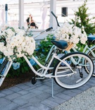 Bikes with Florals
Photography: Nicole Barr Photography
Read More:
http://www.insideweddings.com/weddings/ceremony-overlooking-the-bay-tented-reception-at-beach-house/1295/ two beach cruiser bikes adorned with flowers for at-home wedding decor