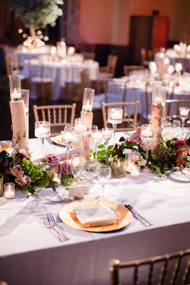 Greenery, Roses, and Birch
Photography: Acqua Photo
Read More:
http://www.insideweddings.com/weddings/balboa-park-wedding-with-wine-inspired-color-scheme-in-san-diego/948/ wedding reception table runner, birch tree branches, lavender roses, candles