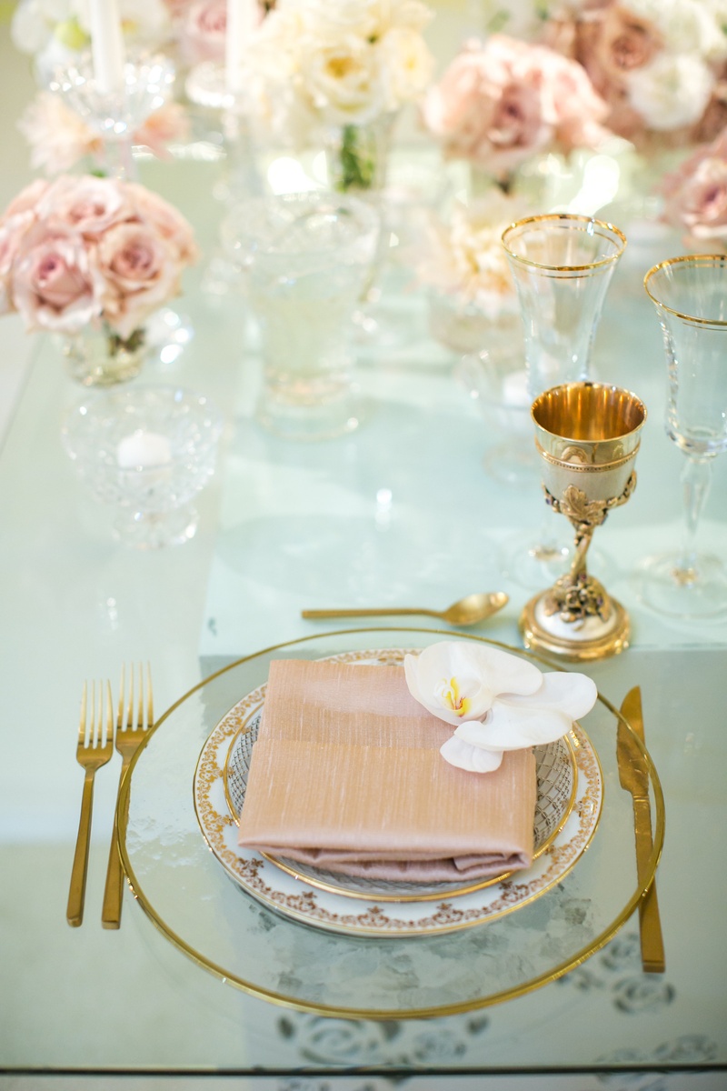 Dusty Rose Napkin with Orchid
Photography: Jessica Claire Photography
Read More:
http://www.insideweddings.com/weddings/traditional-armenian-ceremony-luxurious-ballroom-reception/1006/ clear gold-rimmed charger, dusty rose napkin, white orchid, gold goblet