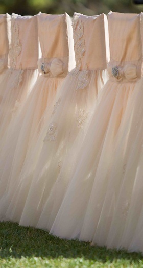 Blush Chair Covers
Photography: Christine Bentley Photography
Read More:
http://www.insideweddings.com/weddings/tamra-barney-and-edward-judge/471/ Pink wedding ceremony chair covers with tulle skirts