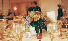 Artichoke %26 Grape Centerpiece
Photography: Tina Carlone Photography
Read More:
http://www.insideweddings.com/weddings/mediterranean-inspired-newport-beach-wedding/39/ Flower centerpiece with artichokes and grapes