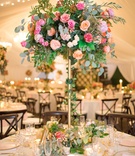 Tall, Colorful Floral Centerpiece
Photography: Angel Canary Photography
Read More:
http://www.insideweddings.com/weddings/alfresco-garden-ceremony-tented-reception-with-vibrant-florals/1027/ gold stand with eucalyptus, ivy, greenery, pink roses, peach roses