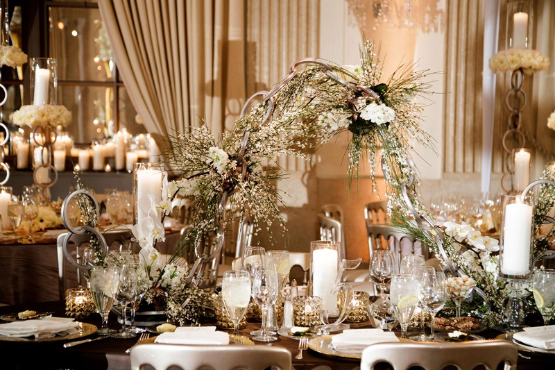 Modern Chain Décor on Table
Photography: Bob %26 Dawn Davis Photography
Read More:
http://www.insideweddings.com/weddings/modern-glamorous-jewish-wedding-with-unique-decor-in-chicago/1154/ wedding reception unique modern decor white flowers greenery chain centerpiece metallic details