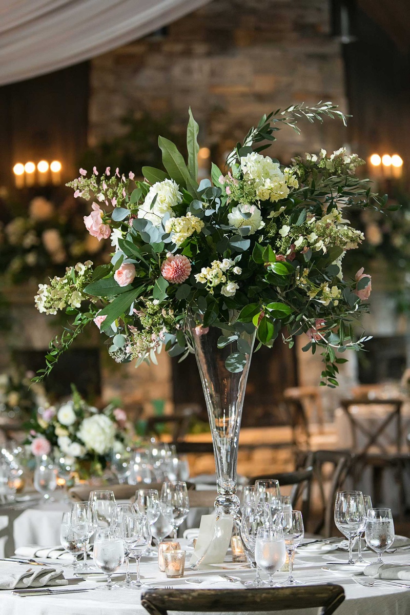 Tall Centerpiece in Rustic-Elegant Venue
Photography: Vue Photography
Read More:
http://www.insideweddings.com/weddings/destination-rustic-fall-wedding-at-a-farm-in-north-carolina/1202/ wedding reception tall centerpiece greenery pink dahlia white flowers