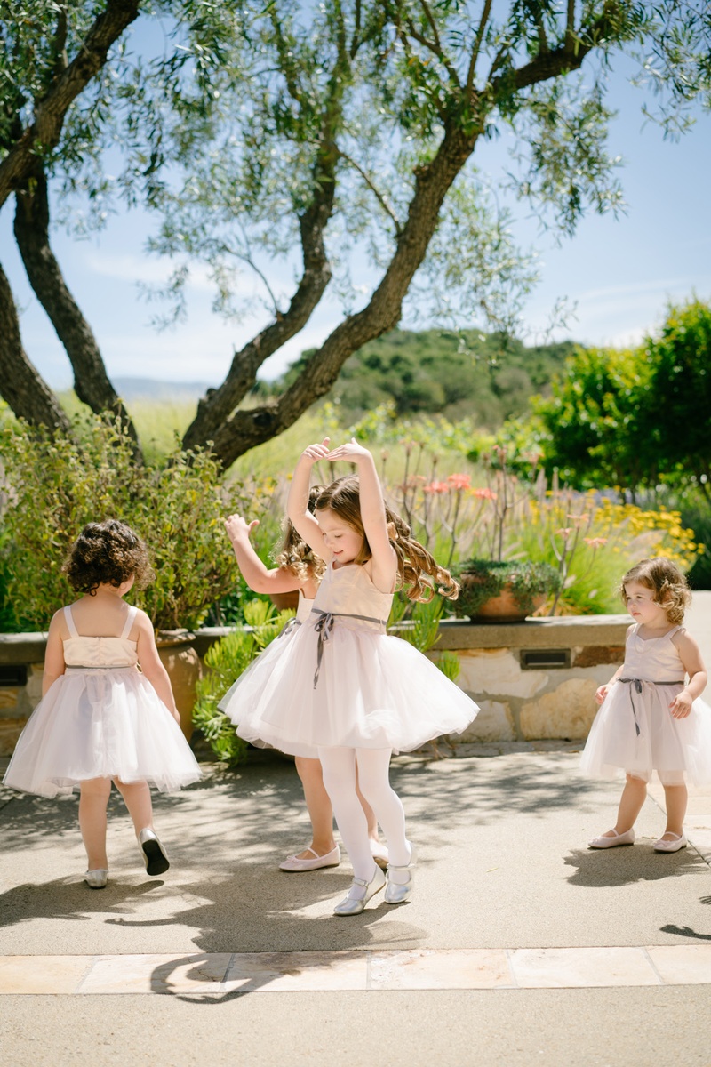 Twirling and Dancing Flower Girls
Photography: Karlisch Photography
Read More:
http://www.insideweddings.com/weddings/modern-rustic-wedding-full-of-flowers-and-geometric-details/906/ flower girls in blush dresses and silver ribbons dance and do ballet twirls