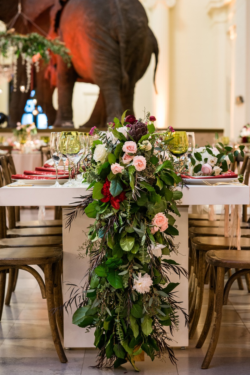 Head Table Verdure %26 Floral Runner
Photography: Kent Drake Photography
Read More:
http://www.insideweddings.com/weddings/an-event-planners-wedding-at-a-museum-by-sue-the-tyrannosaurus-rex/955/ Wedding reception table with flower runner greenery and pink red burgundy flowers