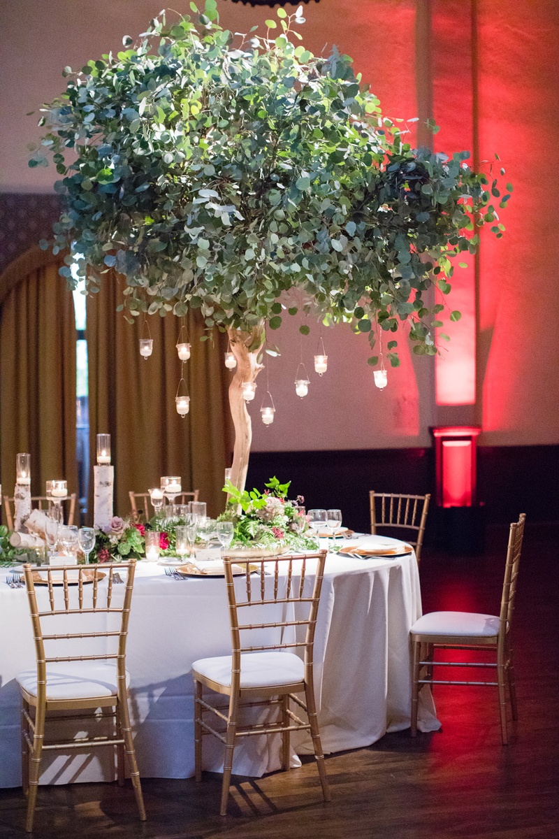 Tree with Suspended Candles
Photography: Acqua Photo
Read More:
http://www.insideweddings.com/weddings/balboa-park-wedding-with-wine-inspired-color-scheme-in-san-diego/948/ Tree as wedding reception centerpiece with hanging candles, chiavari chairs