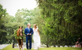 Couple with Horse on Wedding Day
Photography: Images by Berit, Inc.
Read More:
http://www.insideweddings.com/weddings/tented-backyard-wedding-with-equestrian-details-at-a-family-farm/931/ Groom in navy blue suit and tie with bride in sheath wedding dress v neck cap sleeves horse wreath