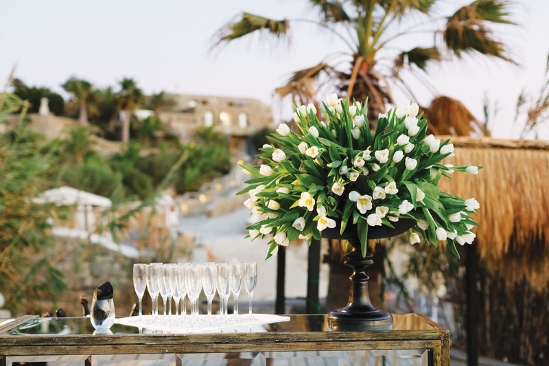 Champagne %26 Tulips on Mirror Bar
Photography: Branco Prata
Read More:
http://www.insideweddings.com/weddings/luxe-destination-wedding-with-view-of-aegean-sea-in-mykonos-greece/1372/ wedding reception bar tulip flower arrangement black vessel champagne flutes on tray mirror bar