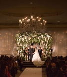 Chuppah at Indoor Wedding Ceremony
Photography: The Day by Ira Lippke
Read More:
http://www.insideweddings.com/weddings/luxurious-fall-wedding-with-pink-elements-in-new-york-city/1166/ wedding ceremony ballroom chuppah twinkle lights behind drapery white orchids blush flowers