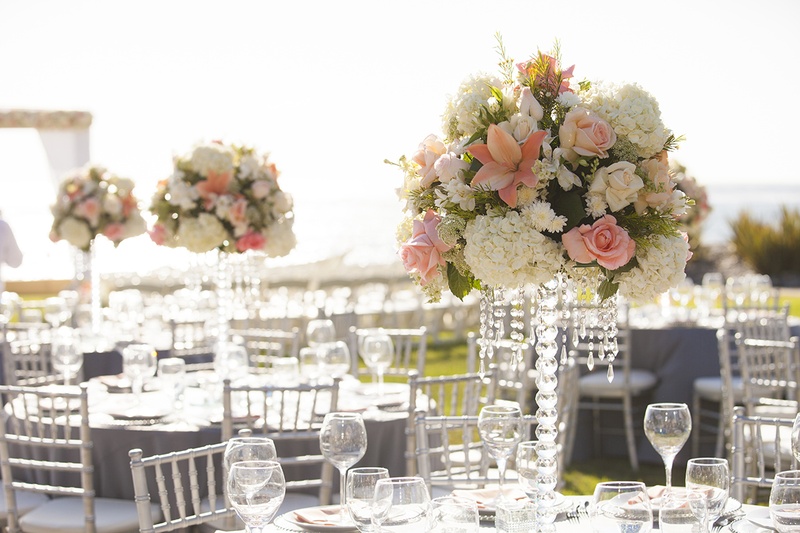 Ivory %26 Coral Tall Centerpieces
Photography: Fusion Estudio
Read More:
http://www.insideweddings.com/weddings/destination-wedding-with-coral-ivory-grey-color-scheme-in-mexico/766/ Crystal centerpiece designs with white hydrangea, orange lily, pink rose flowers and hanging crystal