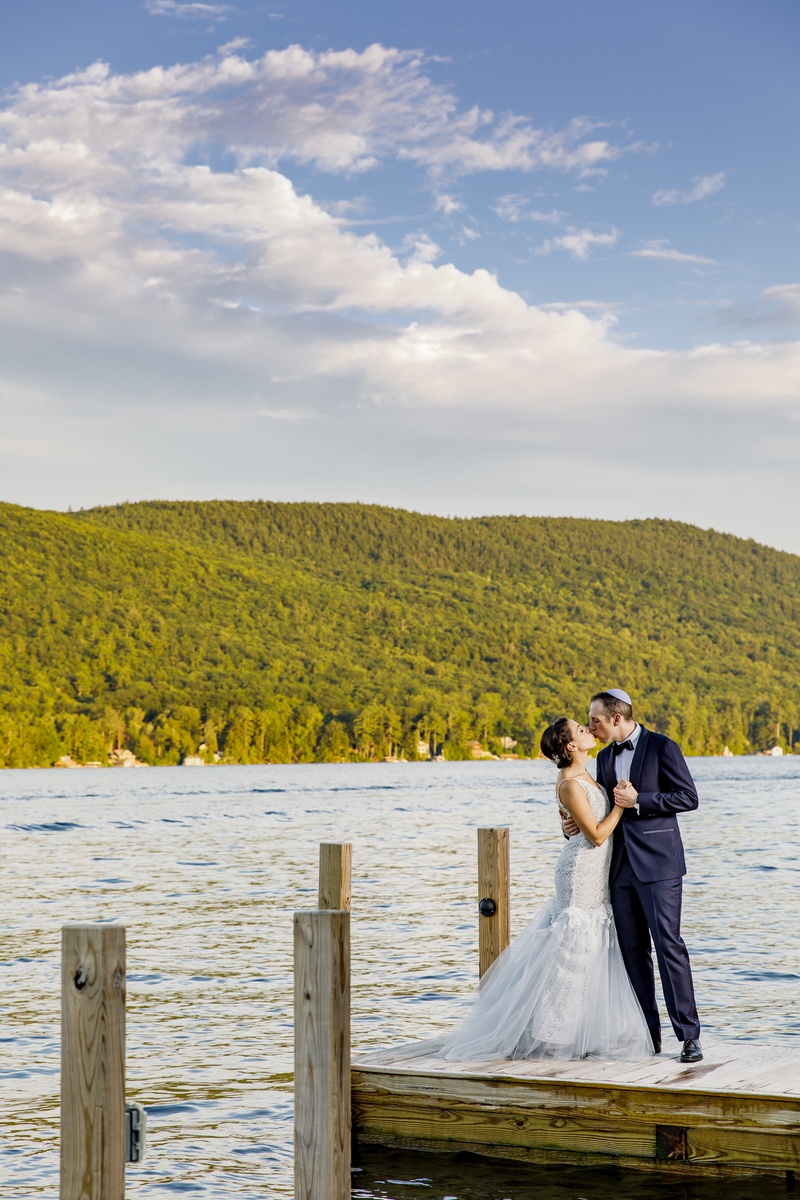 Newlyweds Kissing on Dock
Photography: Amy Anaiz Photography
Read More:
http://www.insideweddings.com/weddings/lakeside-wedding-with-blue-details-in-upstate-new-york/1140/ bride in custom hayley paige wedding dress, groom in navy tuxedo, newlyweds kiss on lake dock