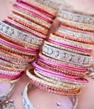 Sparkling Indian Bangles
Photography: John Solano Photography
Read More:
http://www.insideweddings.com/weddings/modern-indian-wedding-in-beverly-hills-california/337/ Pink, silver, and gold crystal-studded bracelets