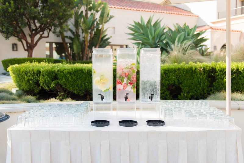 Triple Infused Water Station
Photography: The Yodsukars
Read More:
http://www.insideweddings.com/weddings/glam-10th-wedding-anniversary-party-vow-renewal-in-california/917/ Outdoor wedding drink table water dispensers lemon cucumber strawberry mint ice water