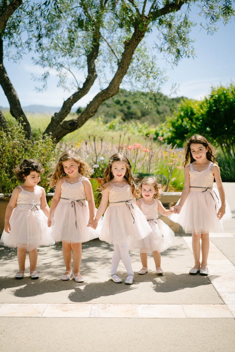 Five Flower Girls Holding Hands
Photography: Karlisch Photography
Read More:
http://www.insideweddings.com/weddings/modern-rustic-wedding-full-of-flowers-and-geometric-details/906/ five flower girls in blush dresses with tulle skirts, silver ballet flats