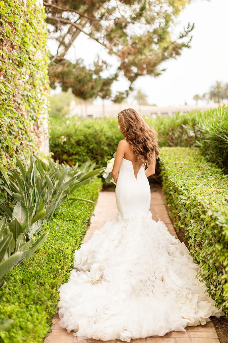 V-Back Detail on Gown
Photography: Chard Photo
Read More:
http://www.insideweddings.com/weddings/alfresco-ceremony-on-the-coast-classic-ballroom-reception/1290/ ines di santo wedding dress with ruffled mermaid skirt and v-back detail