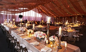 Dusty Rose Wedding Reception
Photography: KingenSmith
Read More:
http://www.insideweddings.com/weddings/luxurious-summer-tent-wedding-on-lake-michigan-in-chicago-illinois/671/ Wedding reception under drapery and string lights with rustic touches
