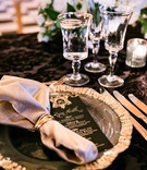 Gold Charger %26 Black Menu Card
Photography: Parker J Pfister Photographer
Read More:
http://www.insideweddings.com/weddings/gorgeous-alfresco-ceremony-tented-reception-at-a-luxurious-estate/1044/ Wedding reception black linens table gold rim glassware and charger black gold menu card calligraphy