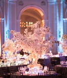 White Winter Wedding Centerpiece
Photography: The Day by Ira Lippke
Read More:
http://www.insideweddings.com/weddings/elegant-winter-wedding-with-frosted-decor-at-a-museum-in-brooklyn/1113/ Wedding reception white centerpiece flowers at base winter wedding blue lighting