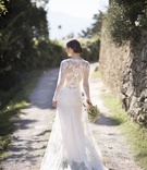 Elegant Dress with Lace Back
Photography: The Day by Ira Lippke
Read More:
http://www.insideweddings.com/weddings/romantic-ceremony-on-bluff-tented-reception-in-tuscany/1311/ back view of bride standing on dirt road in inbal dror lace wrap wedding dress
