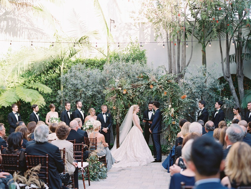 Outdoor Jewish Ceremony at Vibiana
Photography: Mallory Dawn Photography
Read More:
http://www.insideweddings.com/weddings/outdoor-jewish-ceremony-luxe-reception-at-vibiana-in-downtown-la/1259/ bride and groom under wood arbor greenery bistro lights guests in wood chairs white cushions