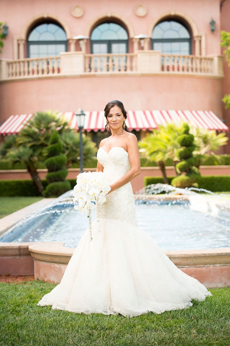 Bride In Front of Mediterranean Fountain
Photography: Boyd Harris Photographs
Read More:
http://www.insideweddings.com/weddings/a-jeweled-floral-wedding-at-fairmont-grand-del-mar-in-san-diego/745/ bride in mermaid romona keveva wedding dress stands in front of fountain at the grand del mar