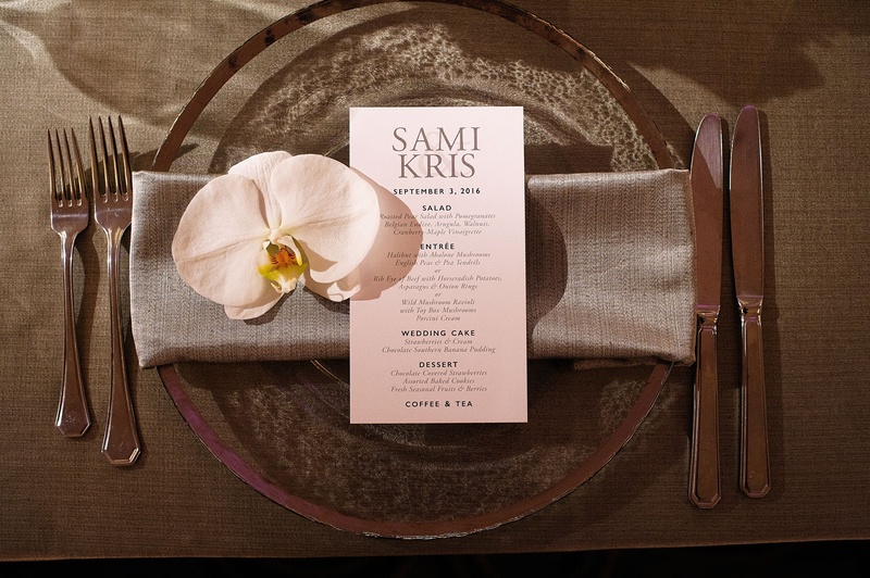 Menu Card with Orchid Blossom on Plate
Photography: Next Exit Photography
Read More:
http://www.insideweddings.com/weddings/alfresco-interfaith-ceremony-ballroom-reception-in-santa-monica/963/ Wedding reception translucent charger plate silver rim with grey napkin simple menu and white orchid