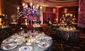Ghost Chair Reception Seating
Photography: KingenSmith
Read More:
http://www.insideweddings.com/weddings/interfaith-candlelit-ceremony-glamour-purple-reception/370/ Silver table linens with clear oval back chairs at wedding reception