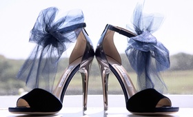 "Something Blue" Bow Shoes
Photography: Jamie Levine Photography
Read More:
http://www.insideweddings.com/weddings/outdoor-ceremony-rustic-tented-reception-on-marthas-vineyard/927/ Jimmy Choo navy blue peep toe shoes with tulle bow at ankle