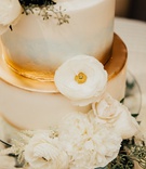 Ivory Cake with Blue %26 Gold Accents
Photography: Ashley Paige Photography
Read More:
http://www.insideweddings.com/weddings/romantic-ocean-view-ceremony-charming-reception-in-california/1337/ wedding cake with greenery fresh flowers white gold light blue accents details airbrush