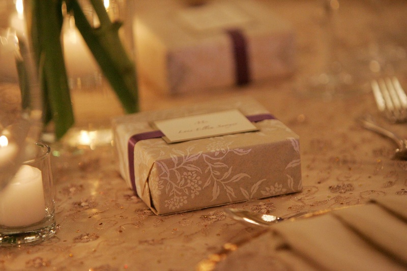 Handmade Favor Boxes
Photography: Lyn Sims Photographer
Read More:
http://www.insideweddings.com/weddings/glamorous-fall-wedding-with-garden-touches-in-tucson-arizona/258/ Ecru and white paper box tied with ribbon