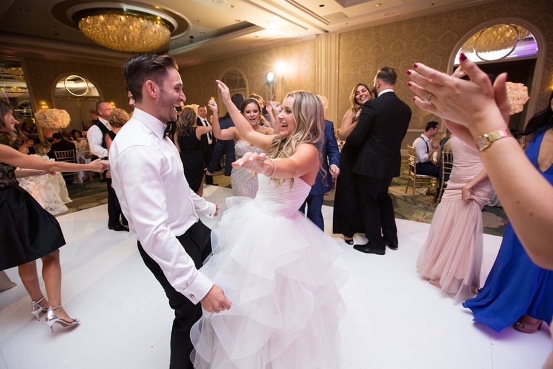 Newlyweds Dance Together with Guests
Photography: Duke Photography
Read More:
http://www.insideweddings.com/weddings/jewish-ceremony-classic-ballroom-reception-in-beverly-hills/922/ bride in reem acra ball gown dances with husband and guests at wedding reception