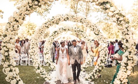 Ivory Floral Arches at Ceremony
Photography: Brian Bossany Photography
Read More:
http://www.insideweddings.com/weddings/luxurious-heaven-inspired-royal-wedding-celebration-in-minneapolis/1333/ wedding ceremony bride in haute couture gown tiara groom in grey tuxedo circle arches white flowers