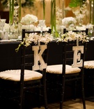 Chair Initials
Photography: Walters %26 Walters
Read More:
http://www.insideweddings.com/weddings/duke-alumnis-chic-all-white-wedding-in-north-carolina/293/ letters k and e hung on back of chairs