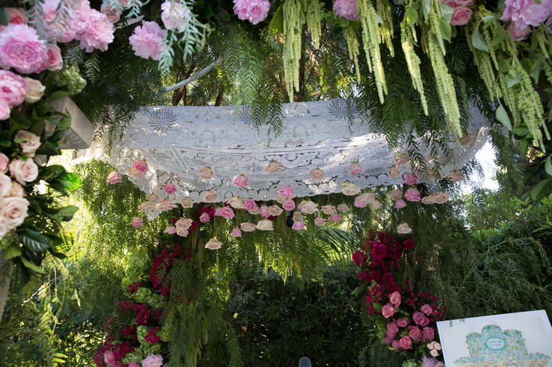 Chuppah with Suspended Pink Roses
Photography: Jay Lawrence Goldman Photography
Read More:
http://www.insideweddings.com/weddings/outdoor-ceremony-ballroom-reception-with-pink-flowers-greenery/1135/ Wedding ceremony jewish pink white rose flowers hanging from canopy amaranthus pink rose