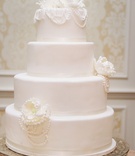 Pearl-Draped Cake
Photography: Millie Holloman Photography
Read More:
http://www.insideweddings.com/weddings/navy-blue-gold-and-ivory-wedding-at-duke-university/558/ White wedding cake with sugar flowers and pearls