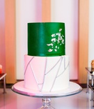 Green-and-White Cake
Photography: Visuals by Arpit
Read More:
http://www.insideweddings.com/weddings/downtown-styled-shoot-featuring-jewel-tones-and-modern-decor/1269/ two tier wedding cake, white tier with silver stick details, emerald green tier with silver gingko