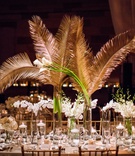 Gold Palms at Wedding Reception
Photography: Roey Yohai Studios
Read More:
http://www.insideweddings.com/weddings/destination-wedding-with-vintage-art-deco-elements-in-new-york-city/1157/ wedding reception centerpiece white flowers gold sago palm leaves greenery long rectangular table