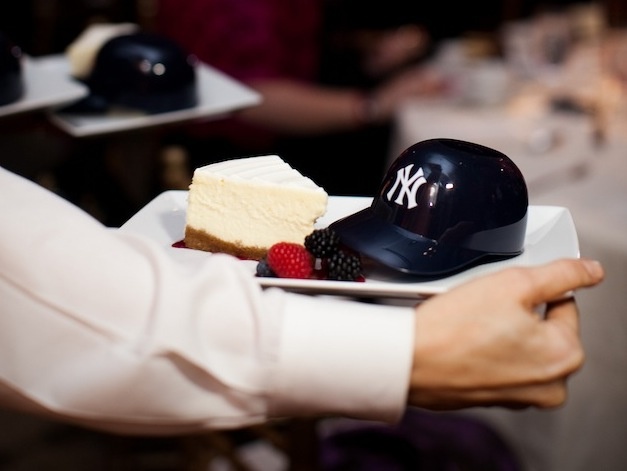New York Yankees Cake
Photography: Jasmine Star Photography
Read More:
http://www.insideweddings.com/weddings/romantic-garden-wedding-in-beverly-hills-california/450/ Cheesecake with mini baseball helmet