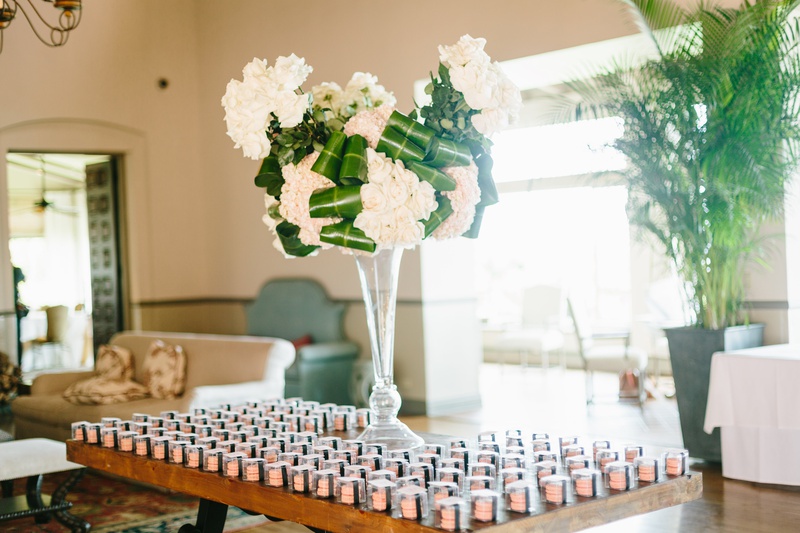 Escort Card Macarons
Photography: Jodee Debes Photography
Read More:
http://www.insideweddings.com/weddings/elegant-alfresco-ceremony-reception-with-parisian-elements/1176/ escort card table with macaron favors, floral arrangement with folded leaves