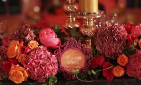 Pink Place Card Frame
Photography: Punam Bean
Read More:
http://www.insideweddings.com/weddings/brightly-colored-fall-wedding-in-new-york/317/ Orange seating card framed in intricate fuchsia