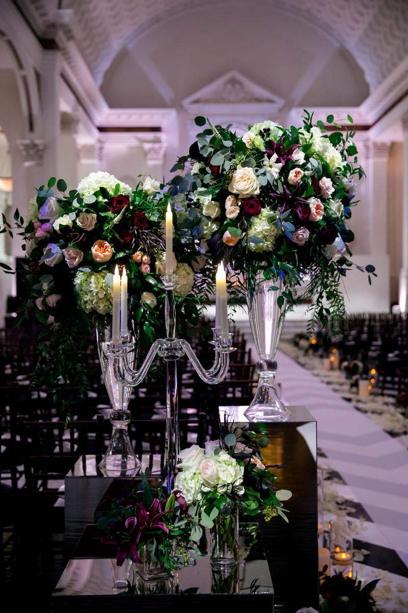Candelabra %26 Flowers on Mirror Riser
Photography: Kim Fox Photography
Read More:
http://www.insideweddings.com/weddings/luxe-vintage-inspired-winter-wedding-in-downtown-los-angeles/1082/ Crystal candelabra on mirror riser with small flower arrangements and glass vases flowers by cina